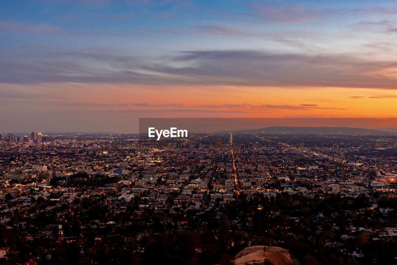 High angle view of city against sky during sunset