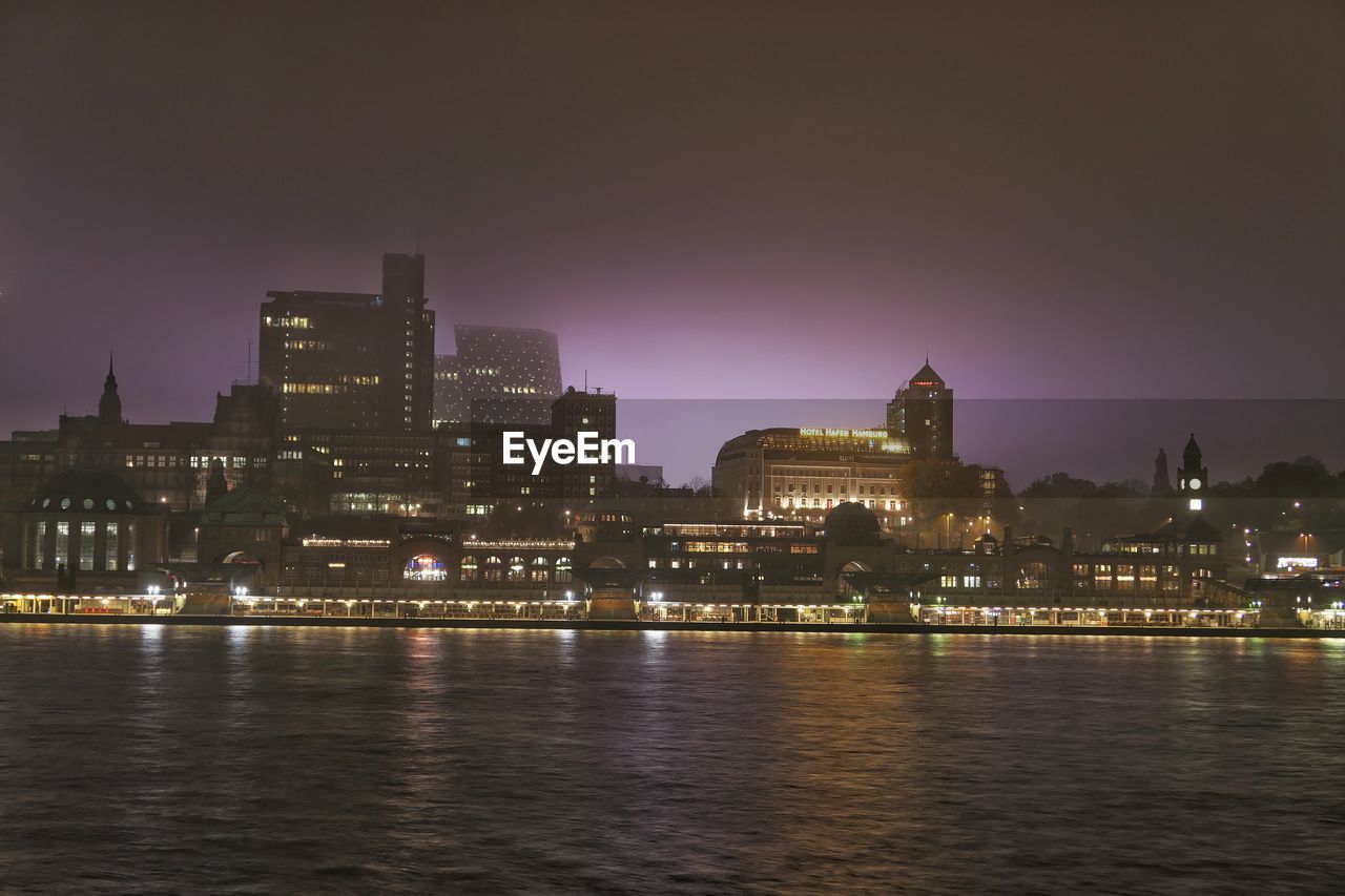 Illuminated buildings in city at night