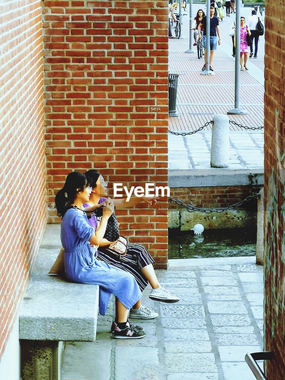 WOMAN SITTING ON STAIRCASE