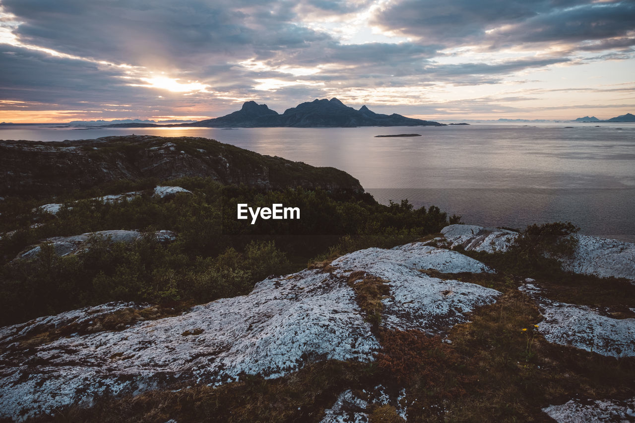 View of mountain island in a cloudy sunset