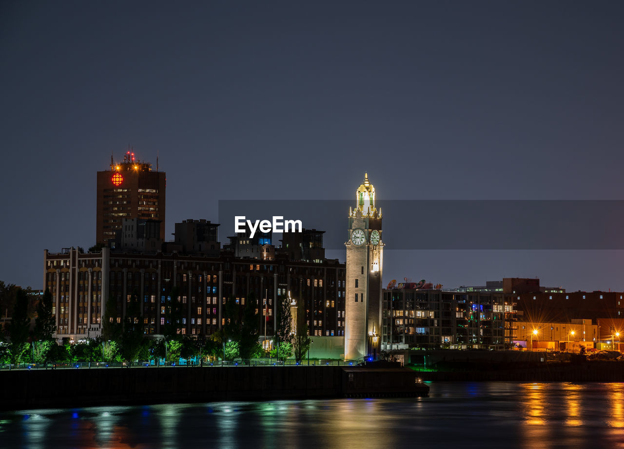 Illuminated buildings in city at night