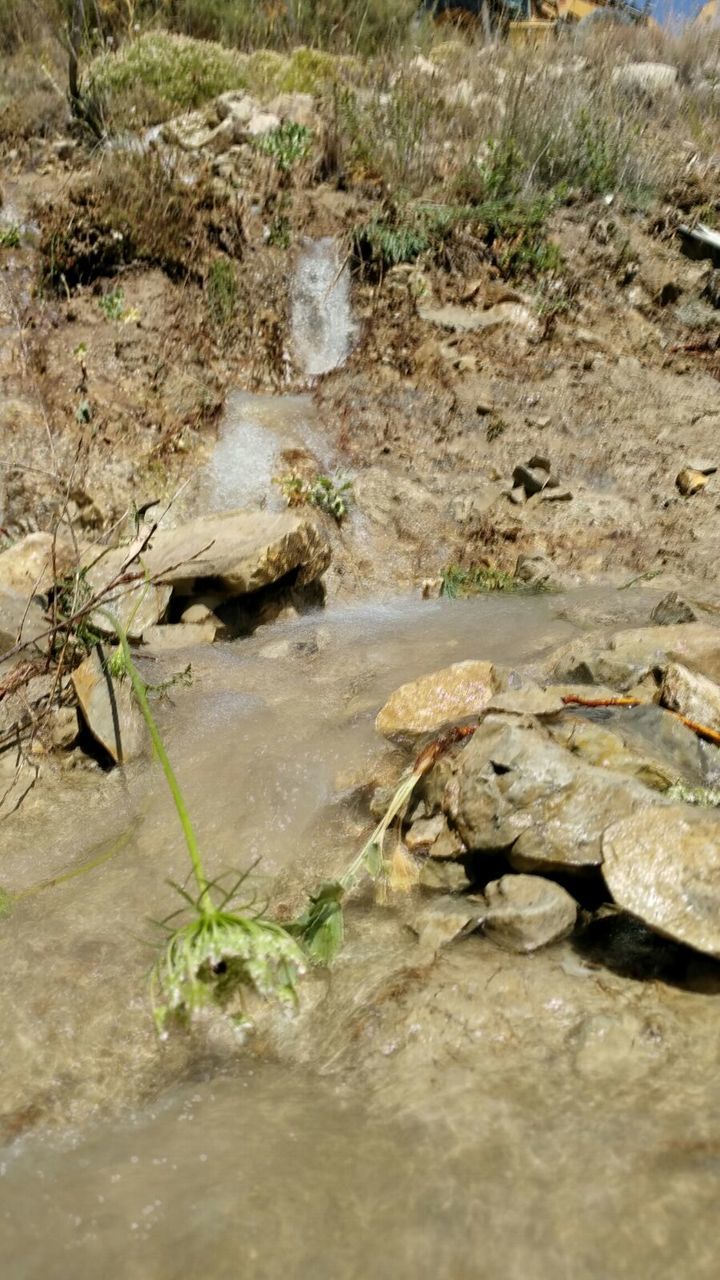 WATER FLOWING FROM PIPE