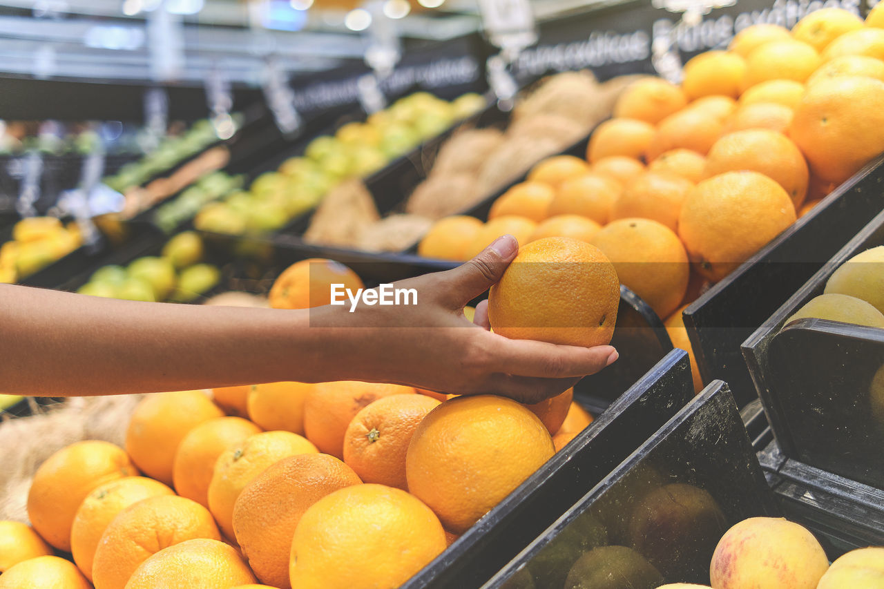 High angle view of orange fruits for sale at market stall