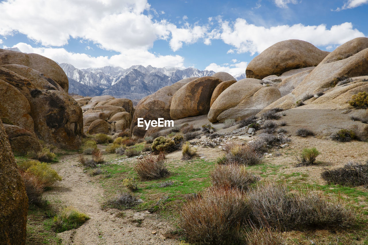 Rock formations on landscape against sky