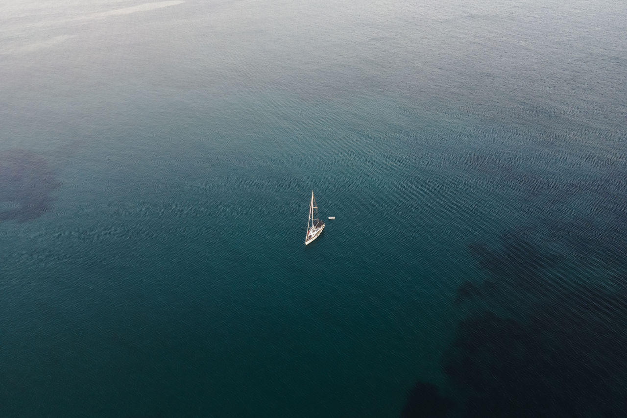 water, high angle view, sea, transportation, nautical vessel, ocean, mode of transportation, nature, day, tranquility, beauty in nature, horizon, scenics - nature, aerial view, tranquil scene, outdoors, waterfront, vehicle, coast, ship, no people, travel, wave
