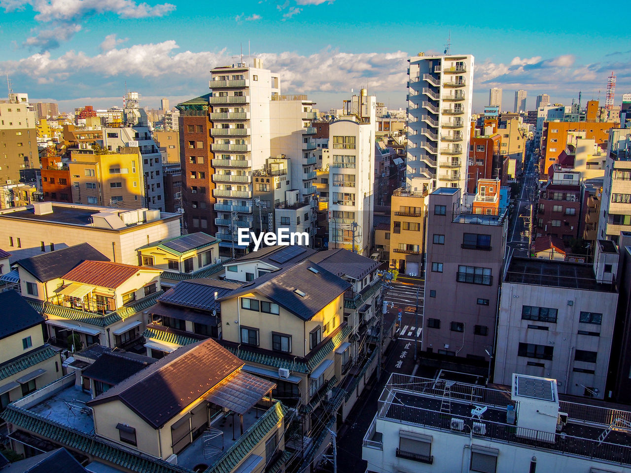 High angle view of buildings in city against sky