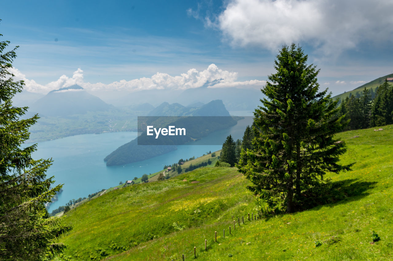 Scenic view of landscape and mountains against sky