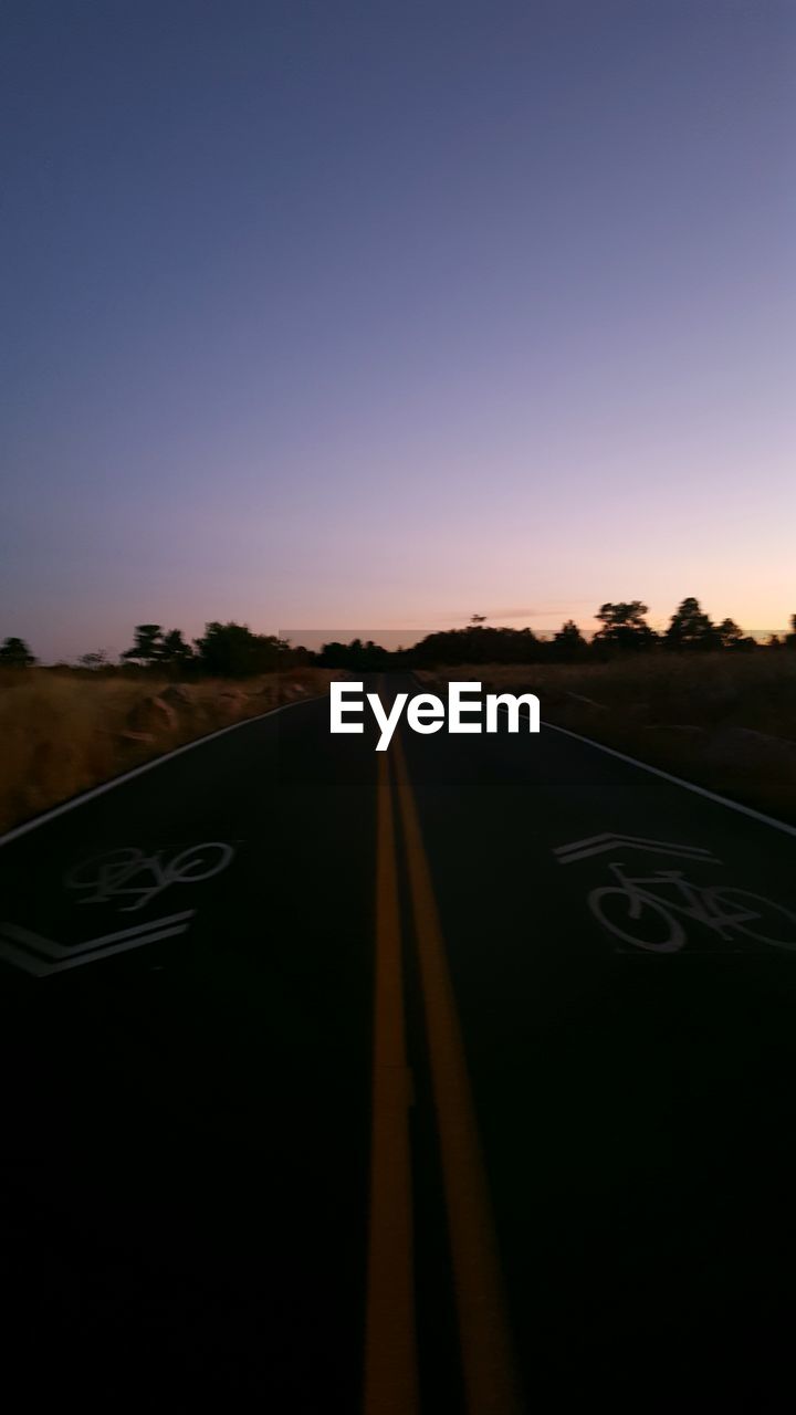 EMPTY ROAD AGAINST SKY