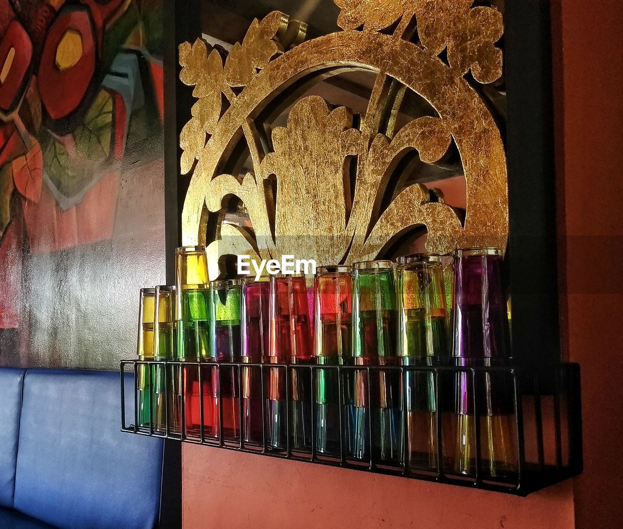 CLOSE-UP OF PAINTBRUSHES ON TABLE AGAINST WALL