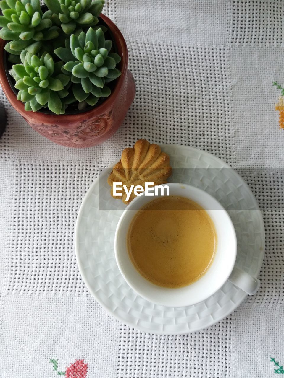 HIGH ANGLE VIEW OF COFFEE CUP AND TEA