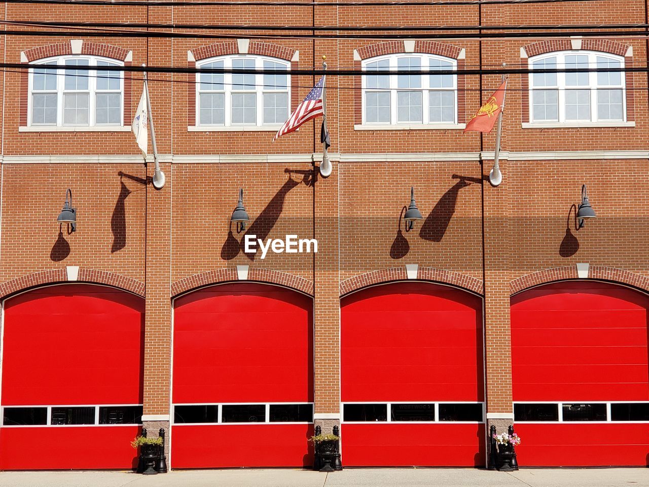 Red doors on wall of fire department building