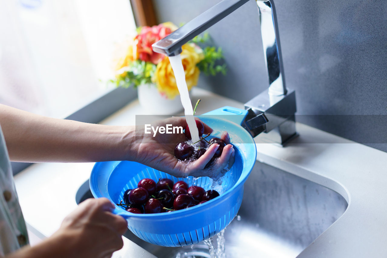 cropped hand of person preparing dessert