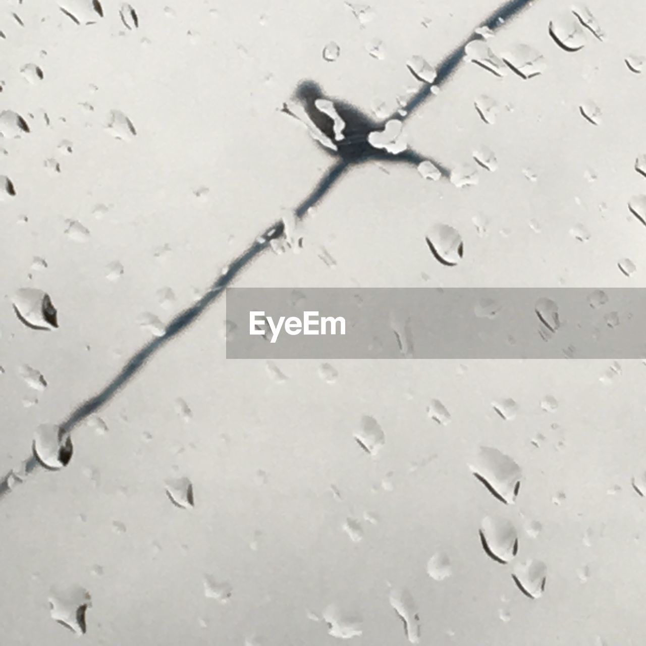 CLOSE-UP OF WET WINDOW