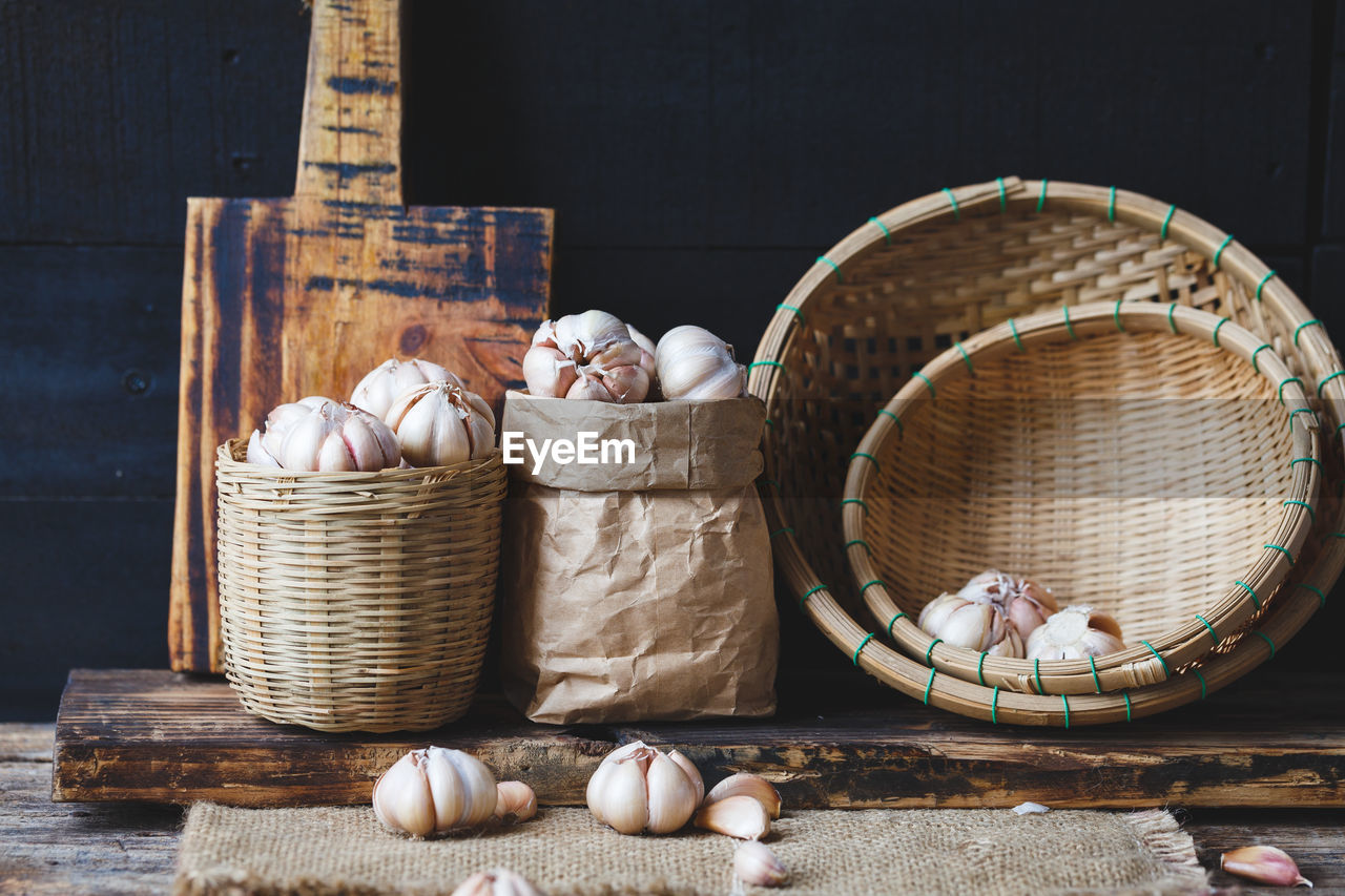 High angle view of garlic in basket on table