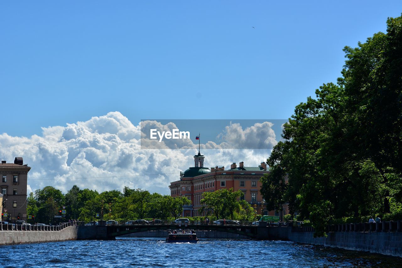 VIEW OF BUILDINGS WITH TREES IN BACKGROUND