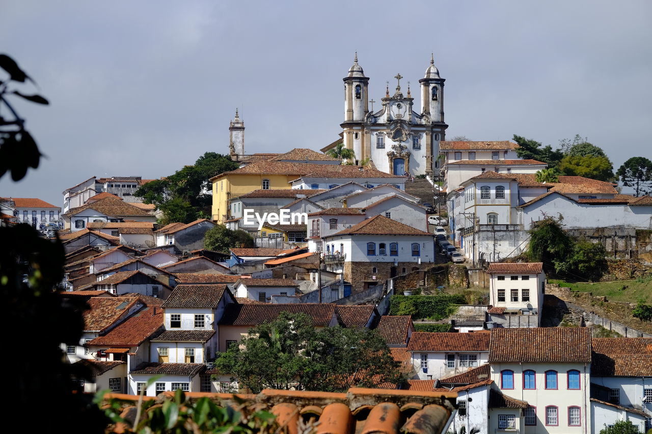 Church with townscape against sky