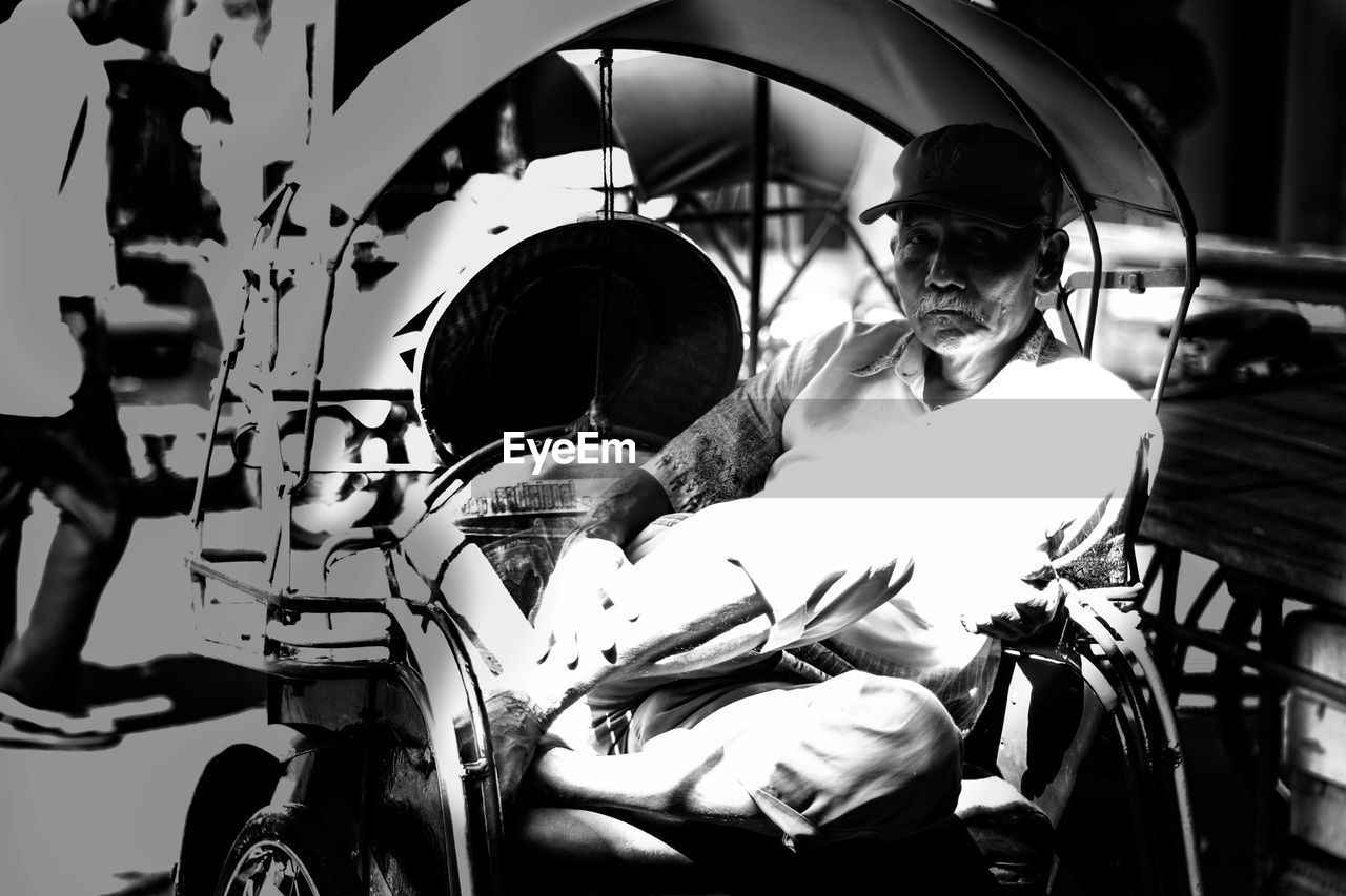 Portrait of senior man sitting in wheelchair