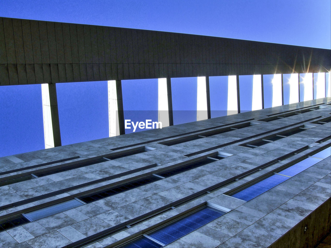 VIEW OF BRIDGE AGAINST BLUE SKY