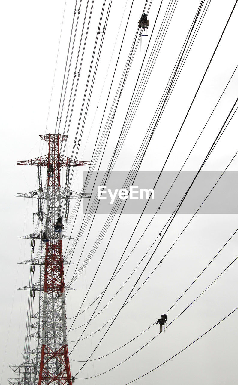 cable, technology, electricity, power line, power supply, transmission tower, electricity pylon, overhead power line, sky, power generation, electrical supply, line, nature, low angle view, communication, no people, mast, tower, outdoor structure, architecture, outdoors, silhouette, built structure, day, complexity, steel cable, telecommunications equipment, cloud, clear sky