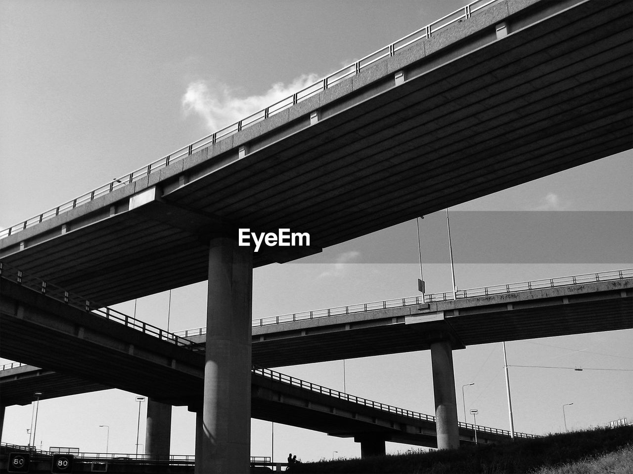 LOW ANGLE VIEW OF BRIDGE AGAINST SKY IN CITY