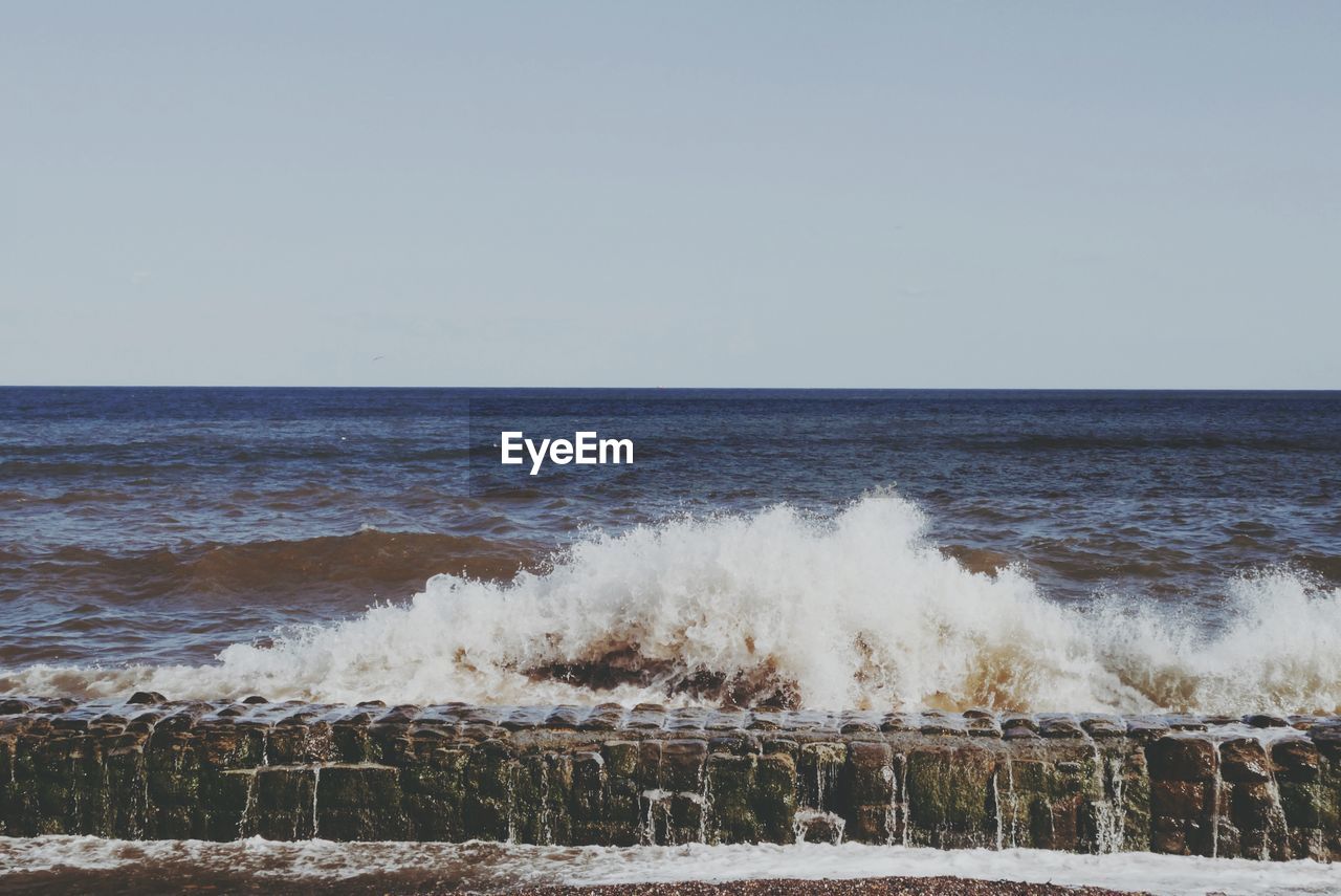 Scenic view of sea against clear sky