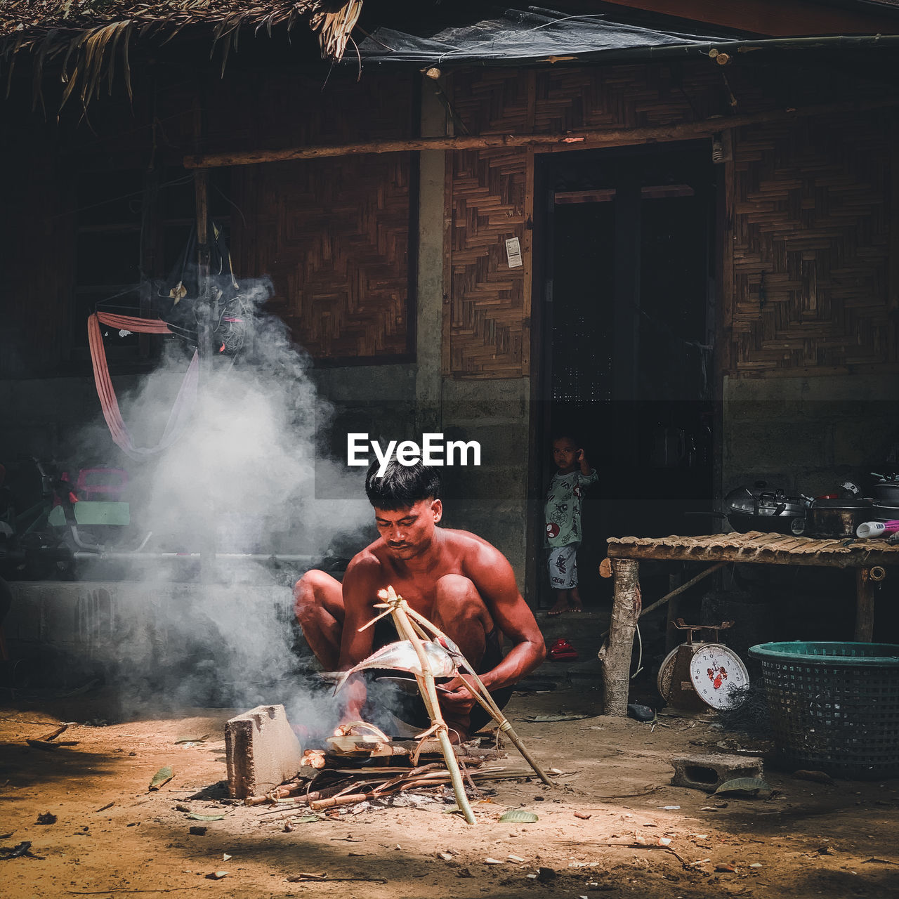 smoke, adult, one person, men, screenshot, occupation, architecture, fire, heat, darkness, person, sitting, nature, working, full length, built structure