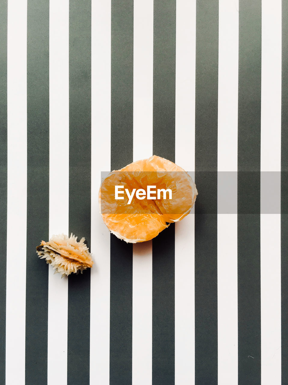 Close-up of orange fruit on white background