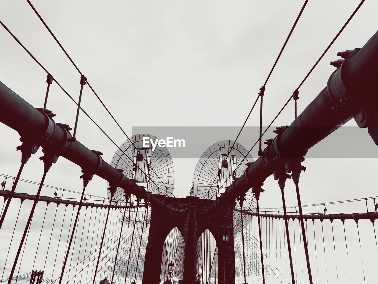 Low angle view of brooklyn bridge against sky
