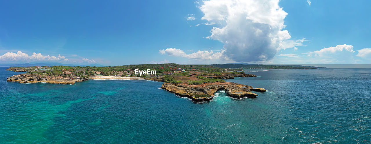 PANORAMIC VIEW OF BEACH AGAINST SKY