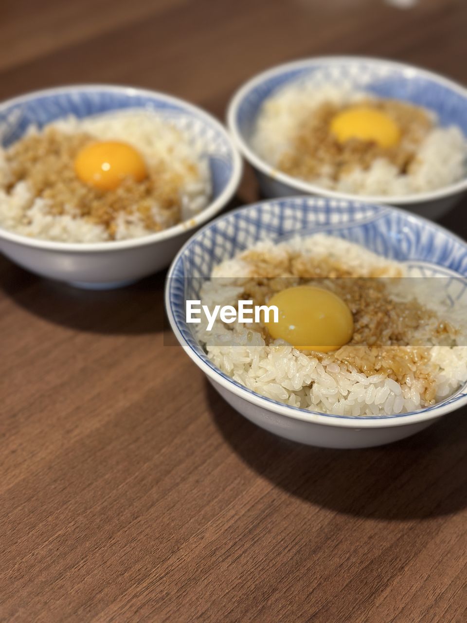 food and drink, food, dish, egg, bowl, healthy eating, wellbeing, breakfast, meal, indoors, freshness, egg yolk, no people, produce, table, asian food, wood, close-up, high angle view, focus on foreground, cuisine