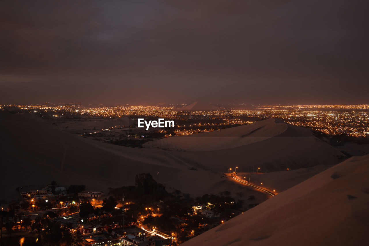 High angle view of illuminated desert at night