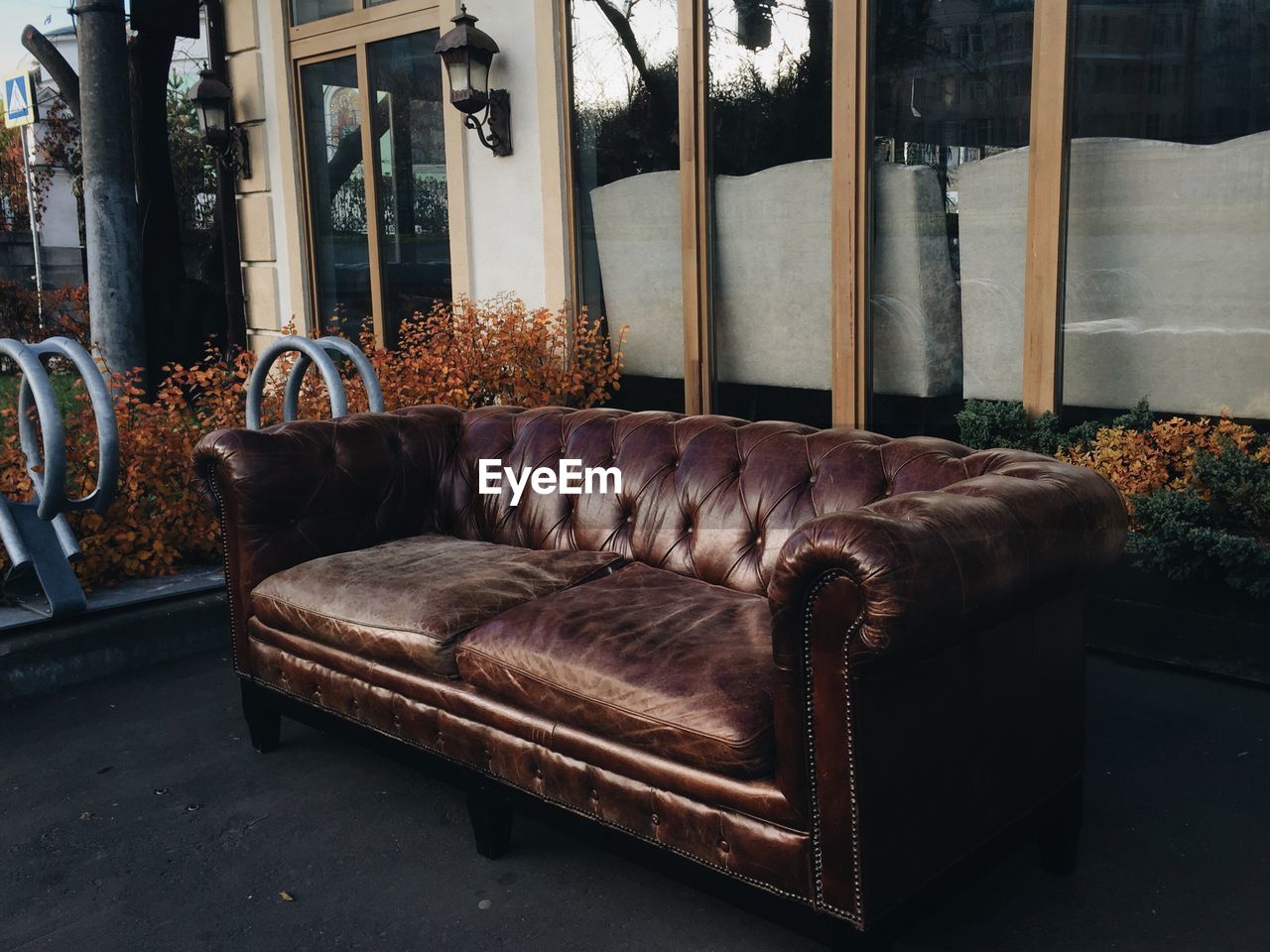 Brown sofa outside house