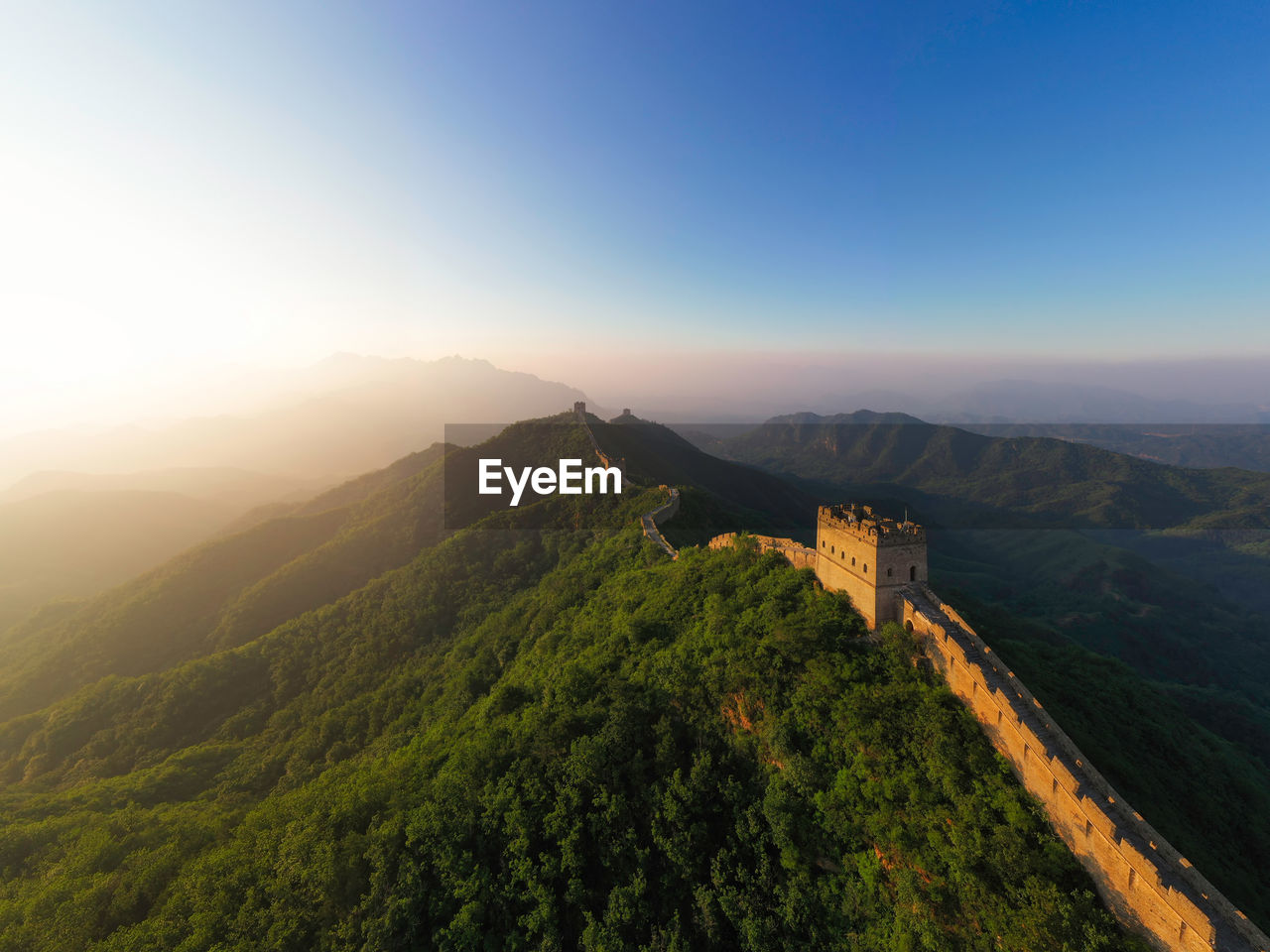 View of the great wall and the mountains under a clear sky