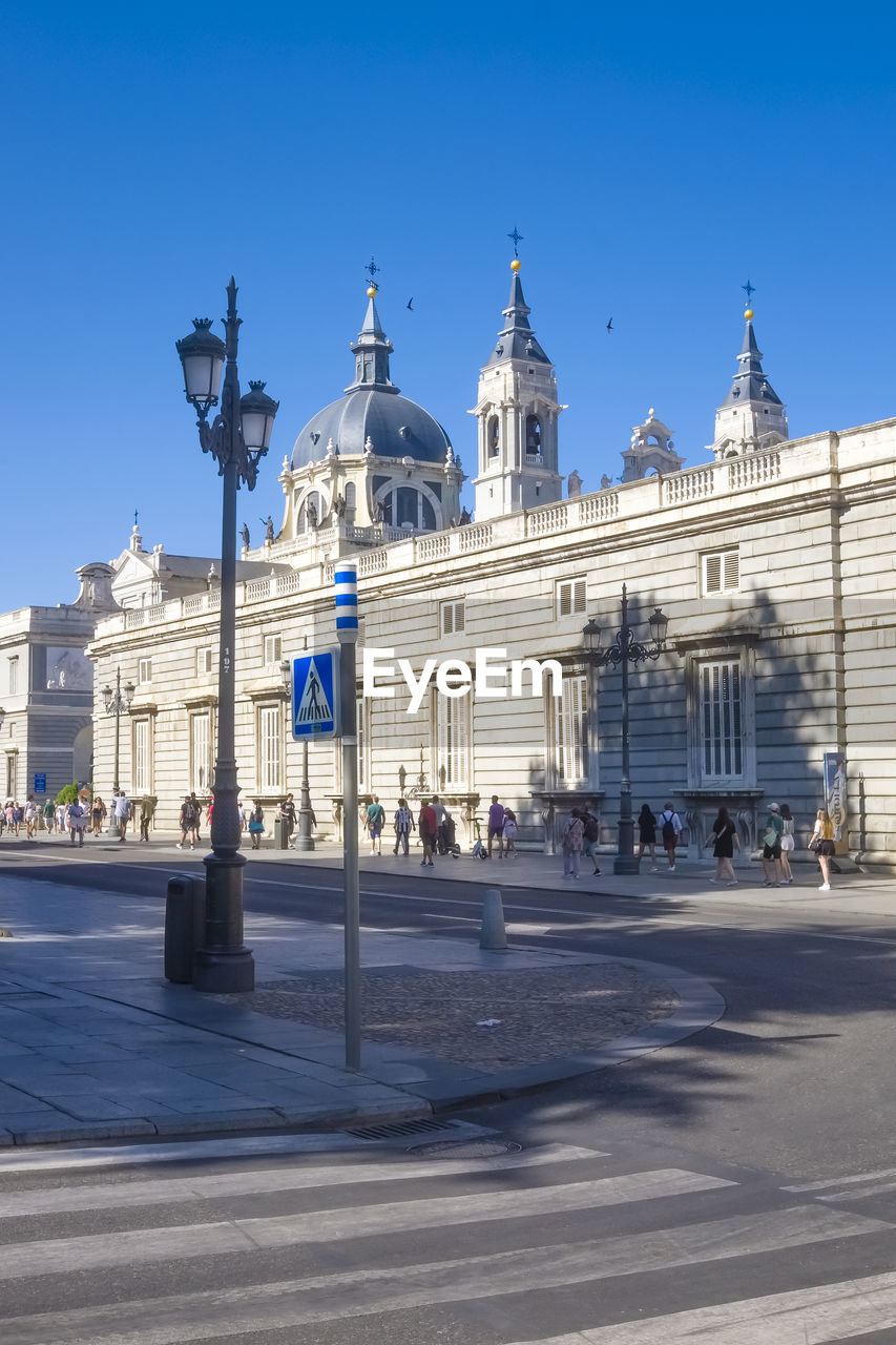 buildings in city against clear blue sky