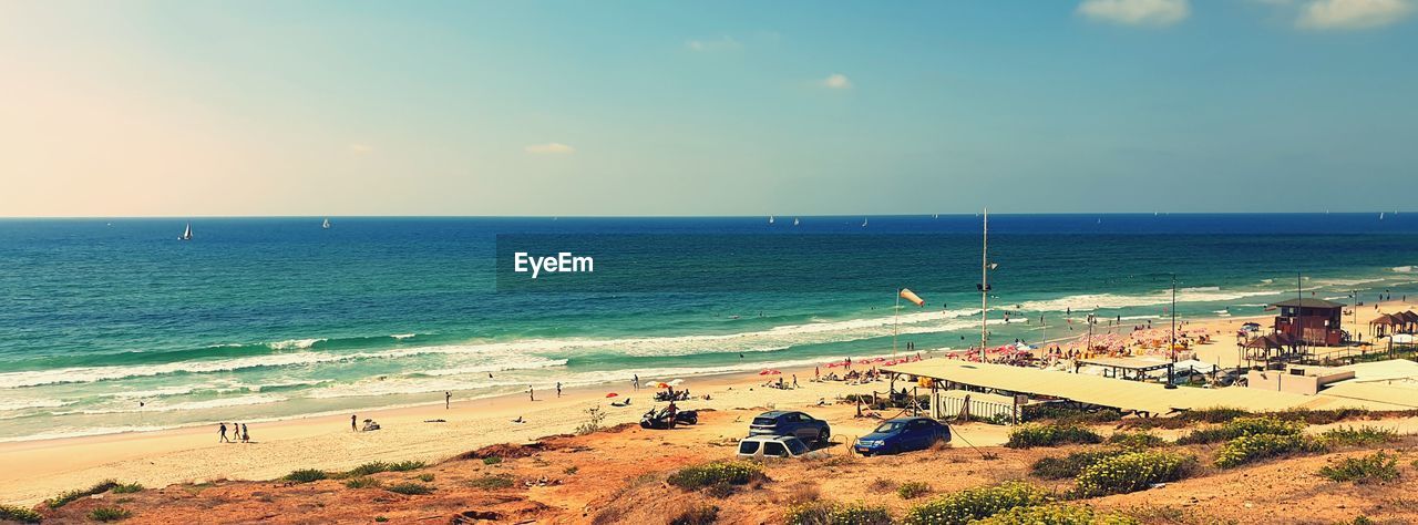 HIGH ANGLE VIEW OF PEOPLE ON BEACH