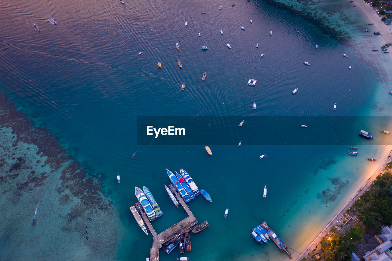 Passenger parking shipping in high season on phi phi island kra bi thailand aerial top view 