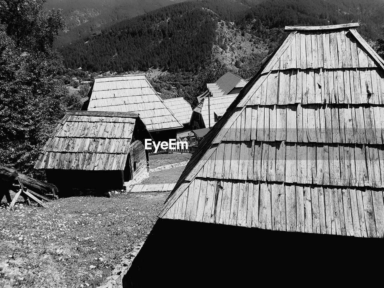 TILT IMAGE OF ROOF AND MOUNTAIN