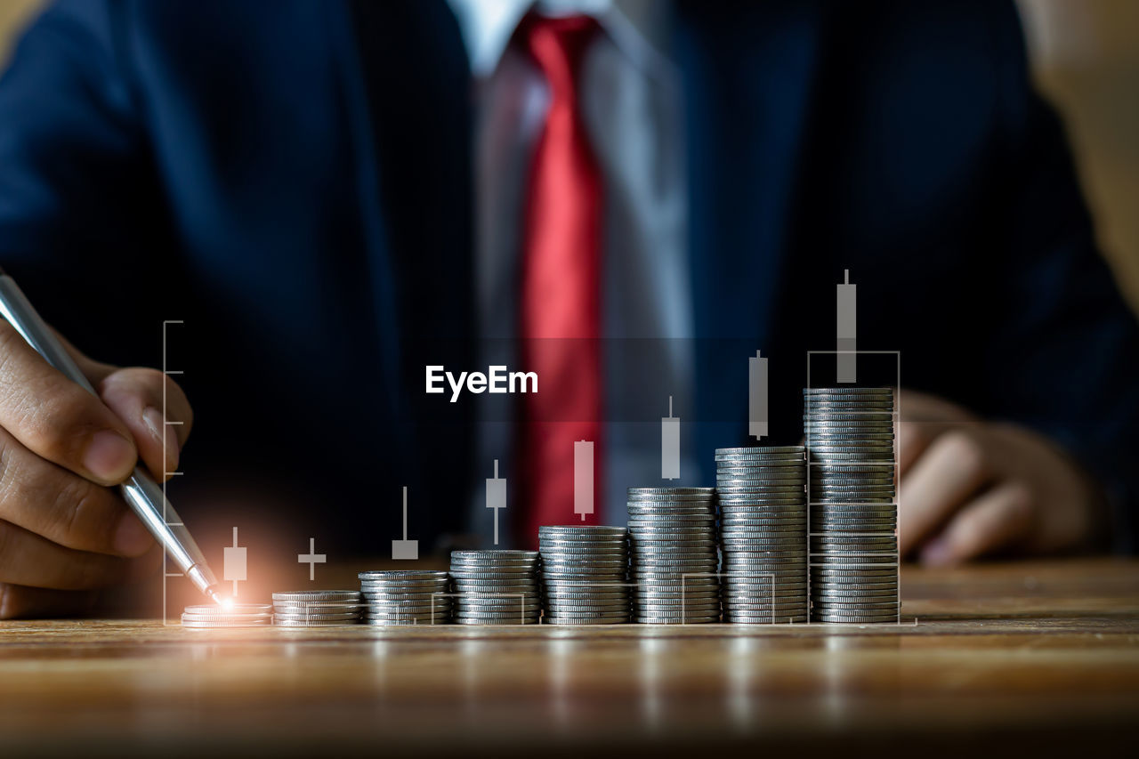 business, finance, adult, businessman, corporate business, one person, men, hand, business finance and industry, currency, occupation, savings, investment, wealth, success, person, graph, midsection, indoors, professional occupation, close-up, selective focus, planning, diagram, clothing, holding, finance and economy, front view