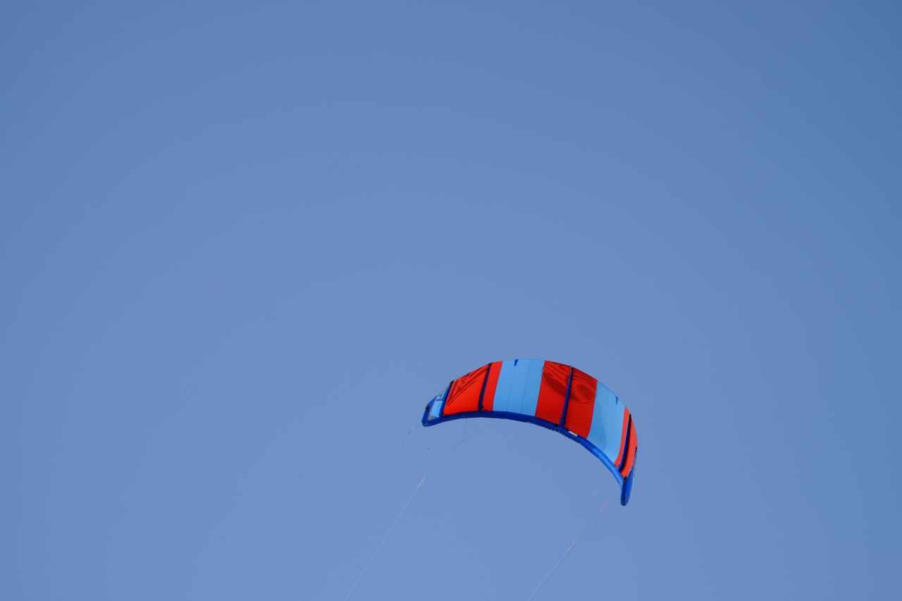 Low angle view of kite against clear sky