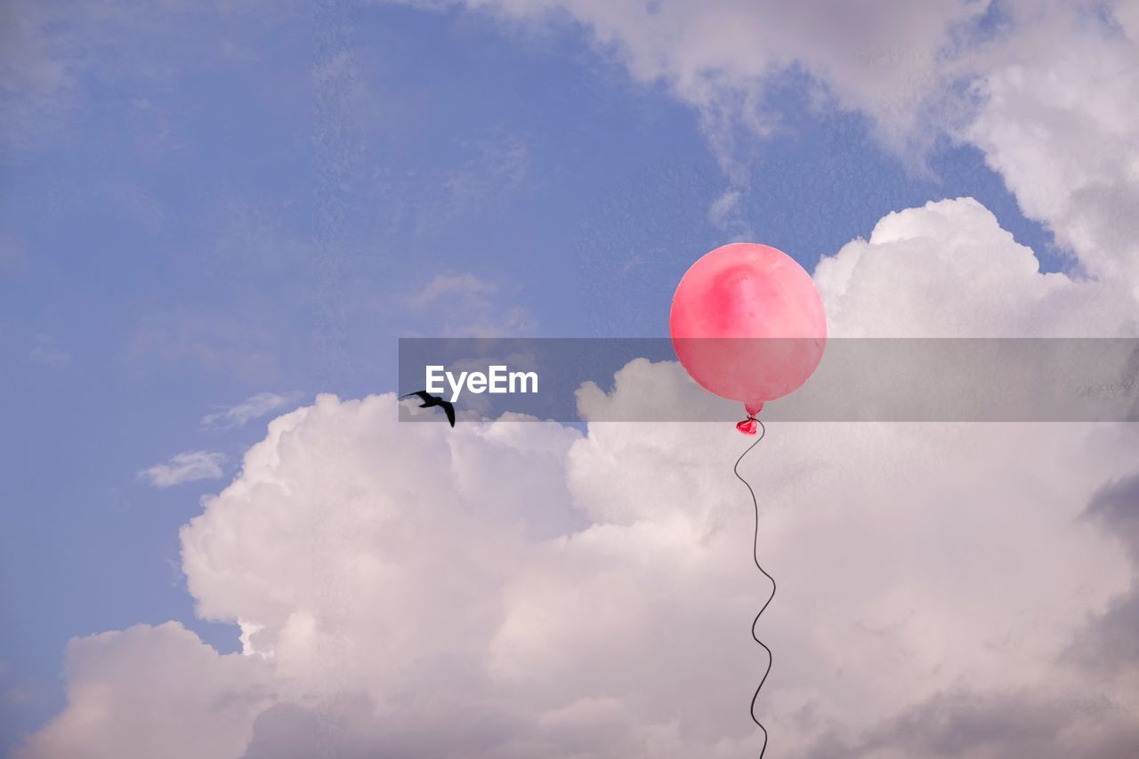 LOW ANGLE VIEW OF BALLOON AGAINST SKY