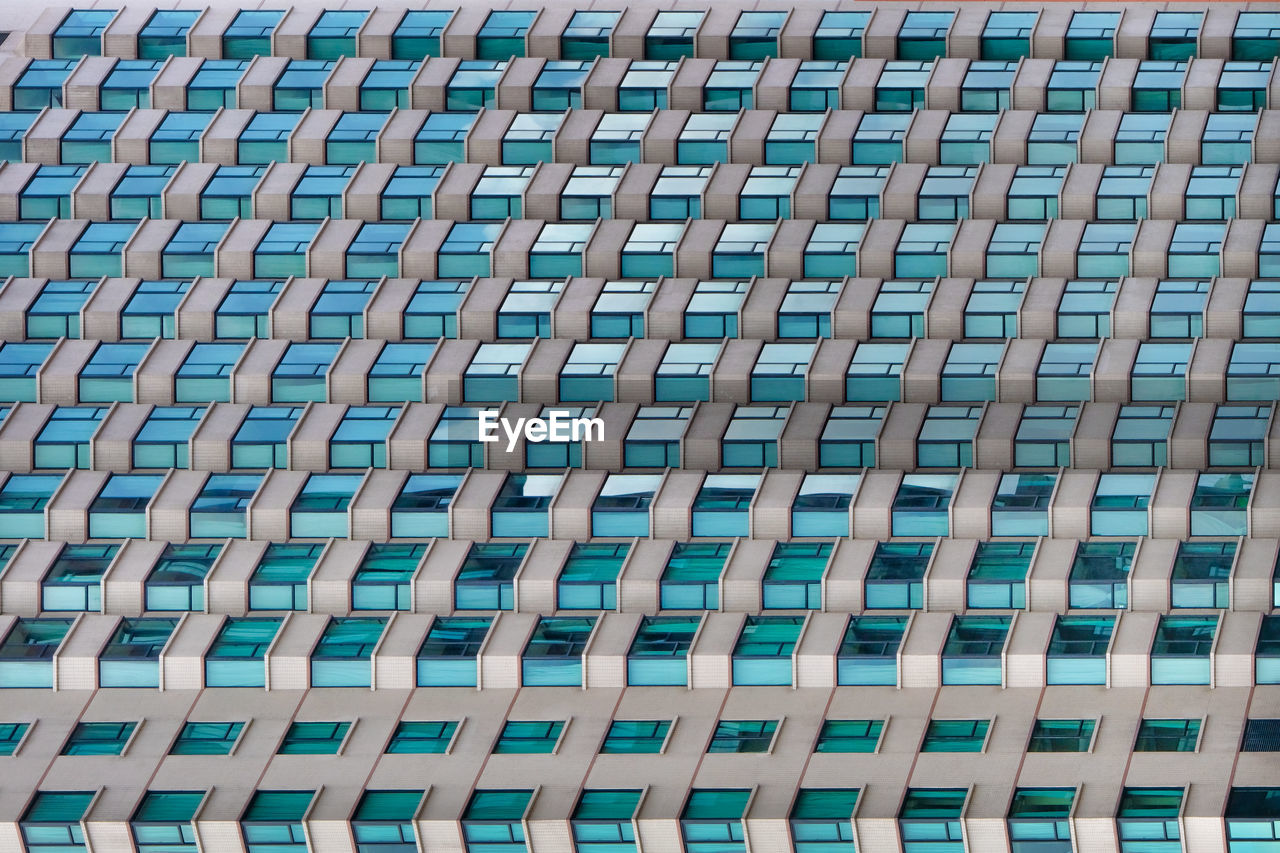 architecture, pattern, full frame, no people, built structure, backgrounds, day, repetition, building exterior, in a row, net, skyscraper, facade, line, building, outdoors, side by side, city, window, high angle view
