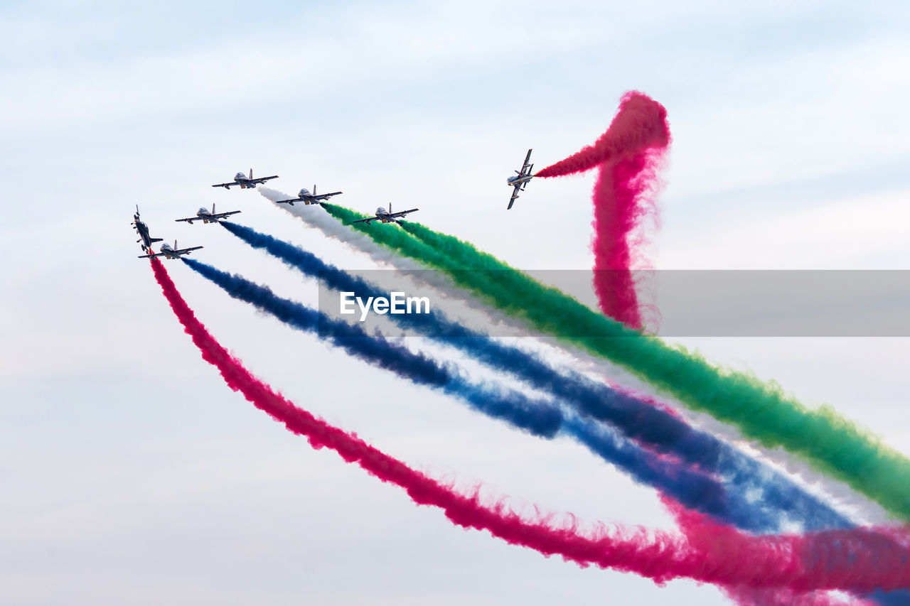 Al fursan aerobatic team doing stunts in the sky in abu dhabi, uae