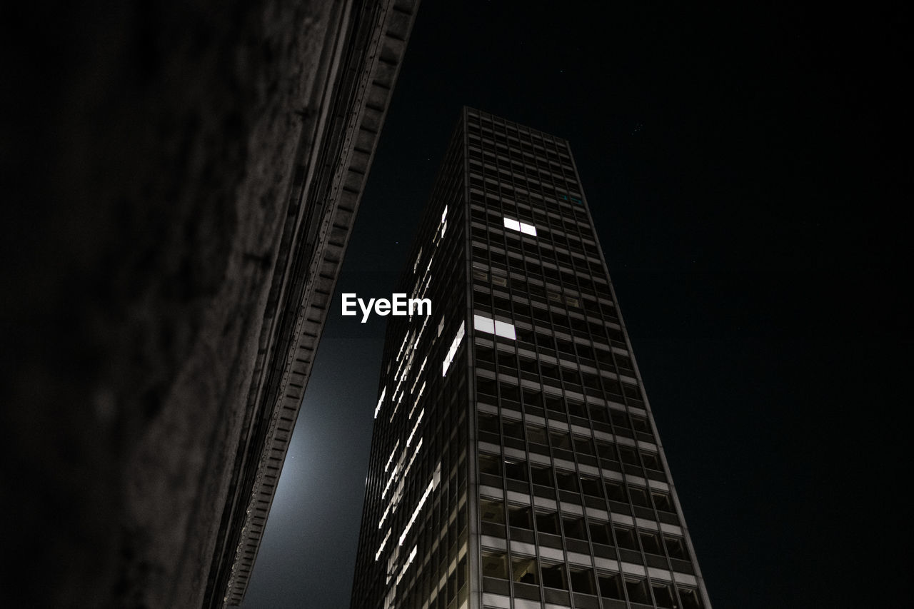 Low angle view of building against sky at night