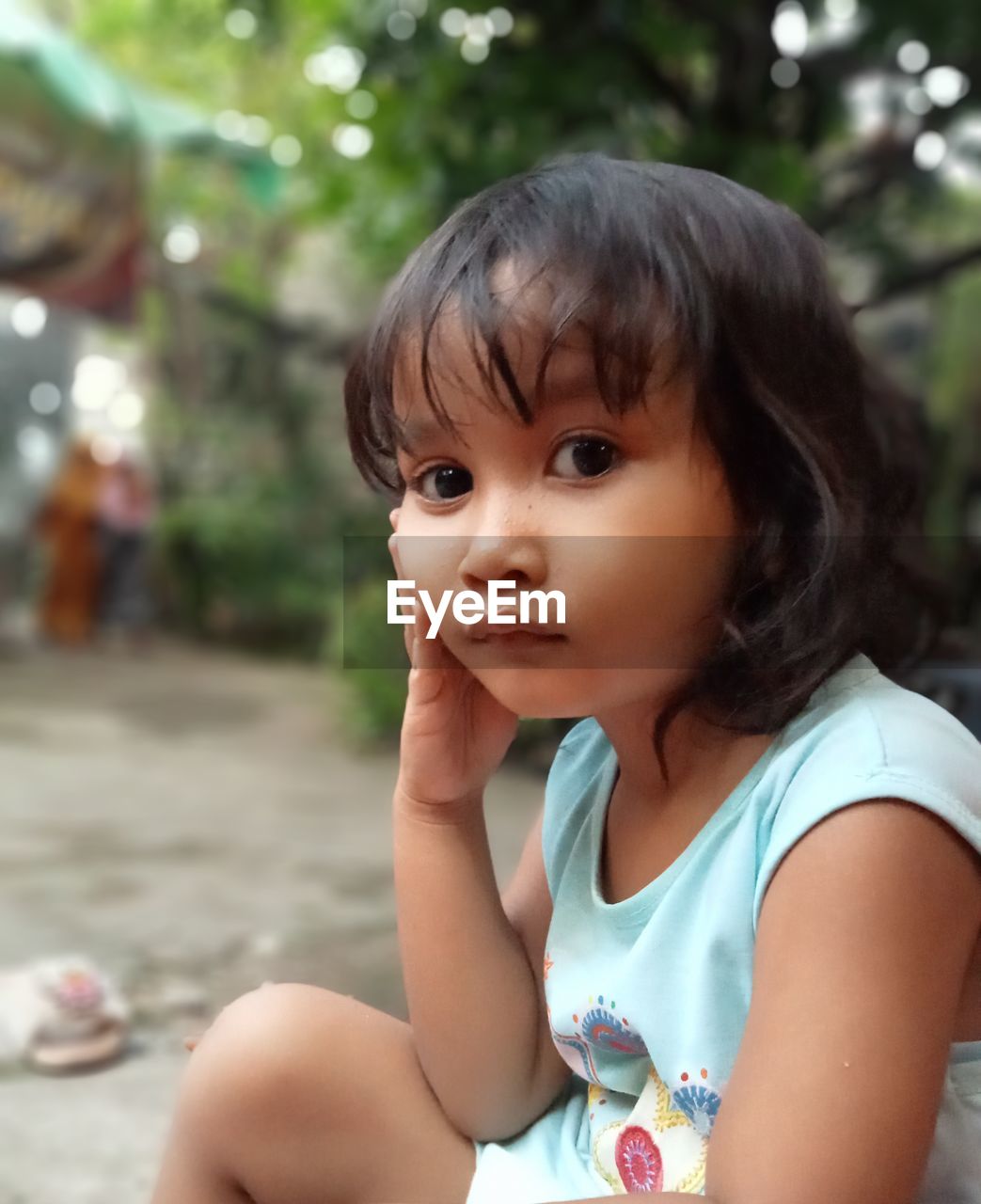 Close-up of cute girl looking away