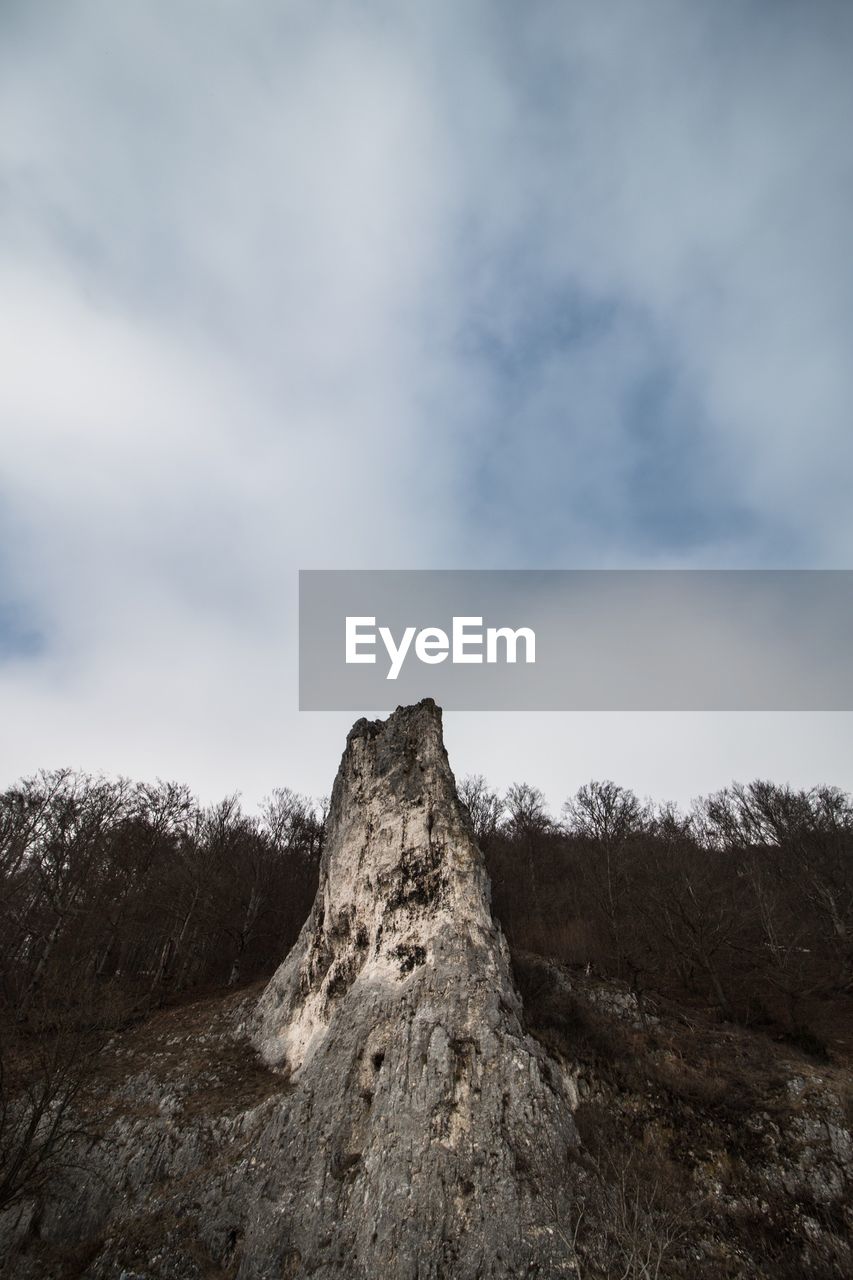 SCENIC VIEW OF MOUNTAINS AGAINST CLOUDY SKY