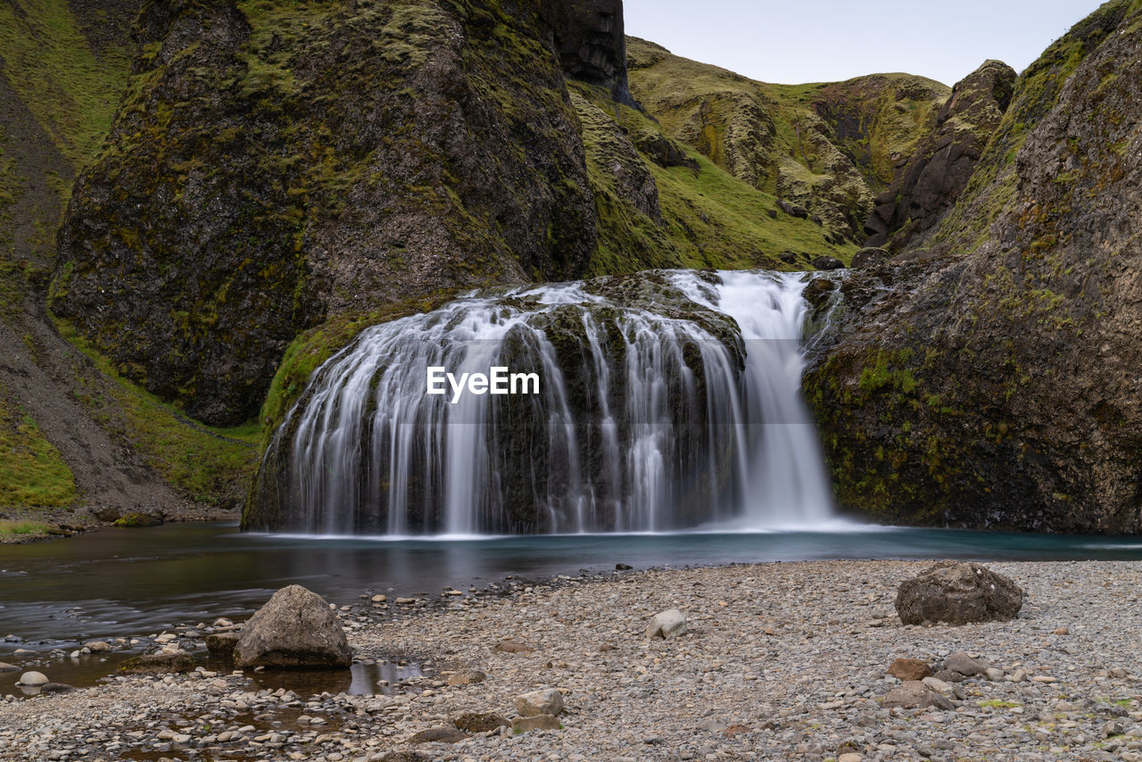 Scenic view of waterfall - stjórnarfoss