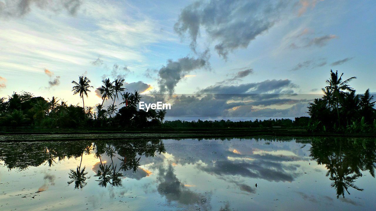 Scenic view of lake against sky during sunset