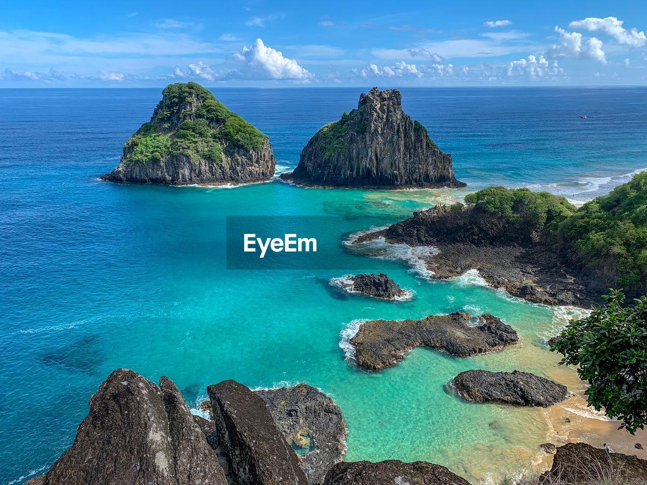 Panoramic view of rocks on beach against sky