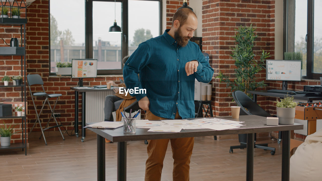 portrait of young man working at table