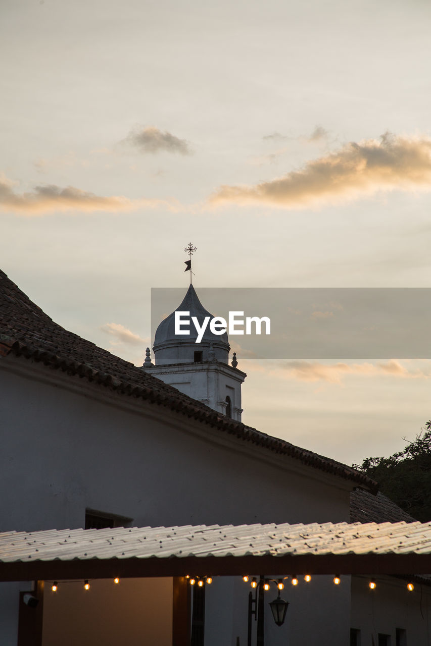 Church against sky during sunset